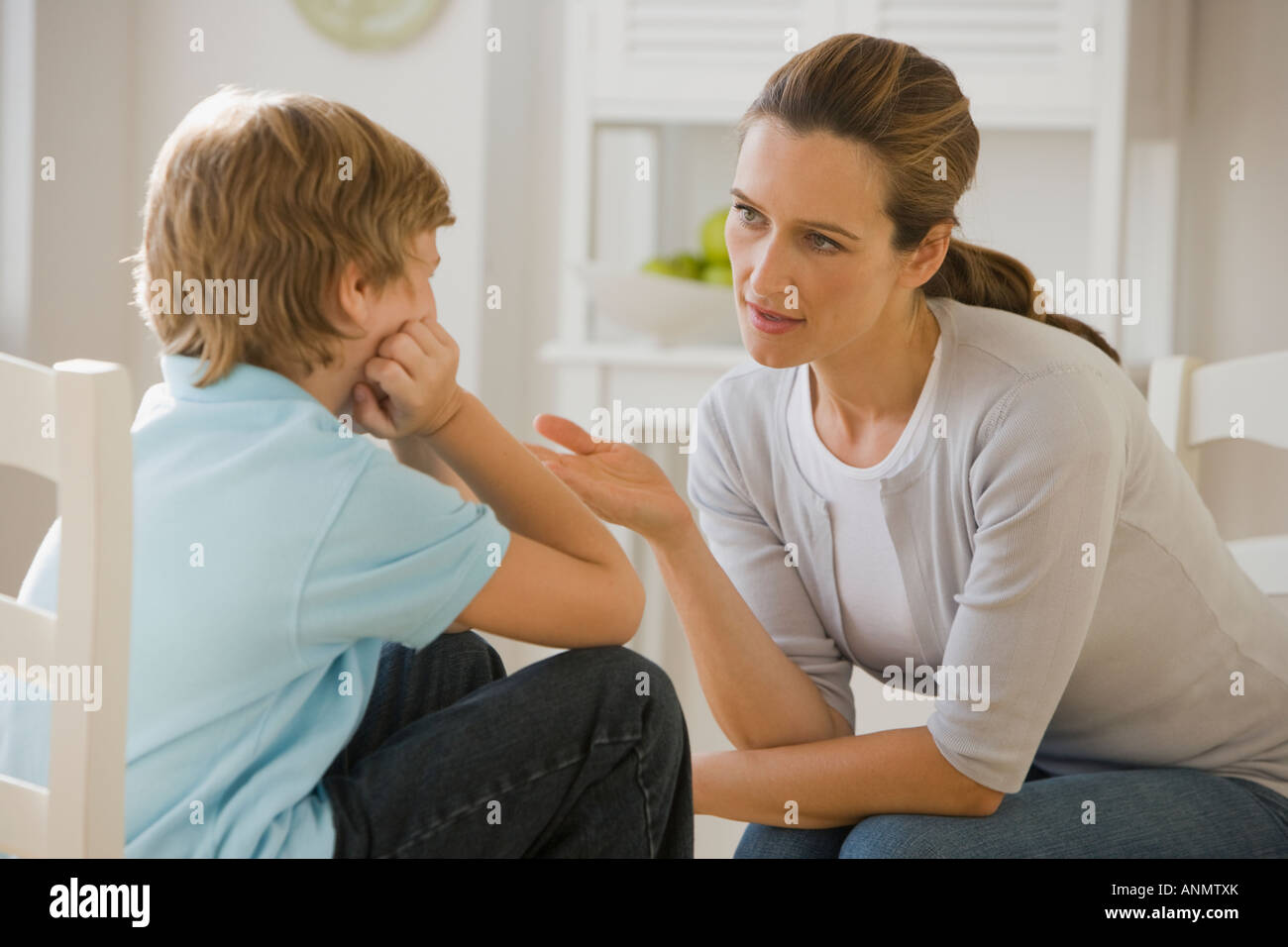 Mother having discussion with son Stock Photo