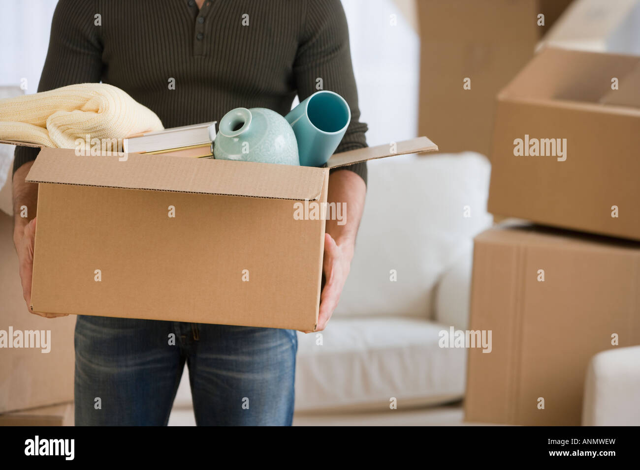 Box carrying man midsection hi-res stock photography and images - Alamy