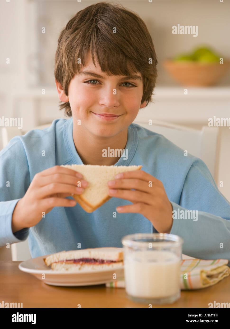 Boy eating sandwich Stock Photo