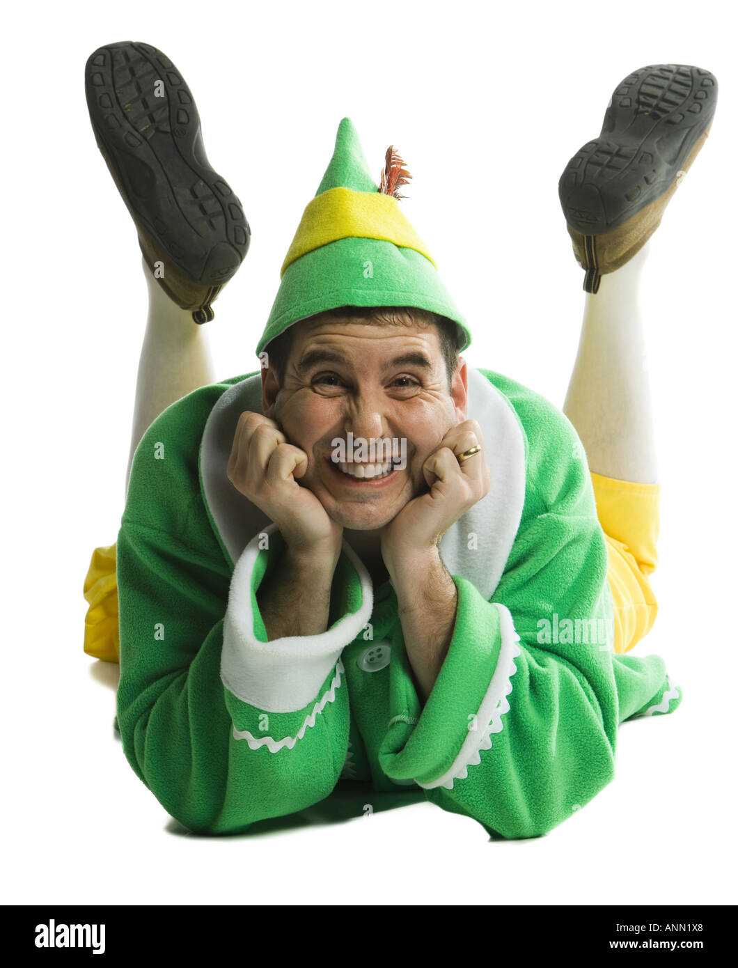 Portrait of a young man lying down in elf costume Stock Photo