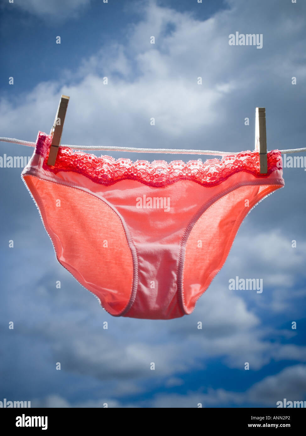 Low angle view of womens underwear hanging on a clothesline Stock Photo -  Alamy