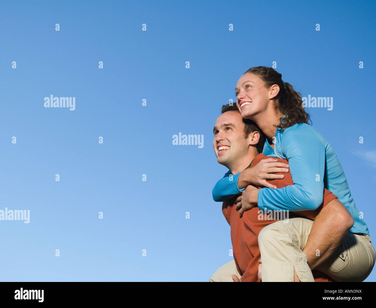 Midadult Caucasian Woman Giving Man Piggyback Stock Photo 3194063