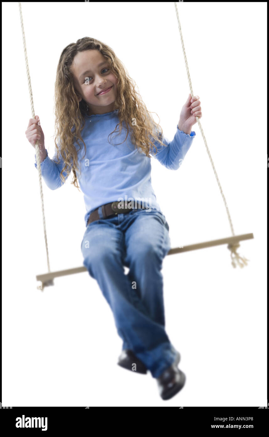 Portrait of a girl sitting on a swing Stock Photo - Alamy