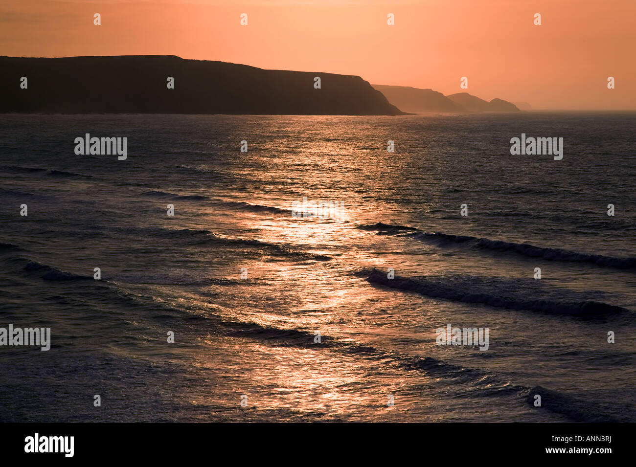 Seascape sunset with cliffs on the horizon Stock Photo