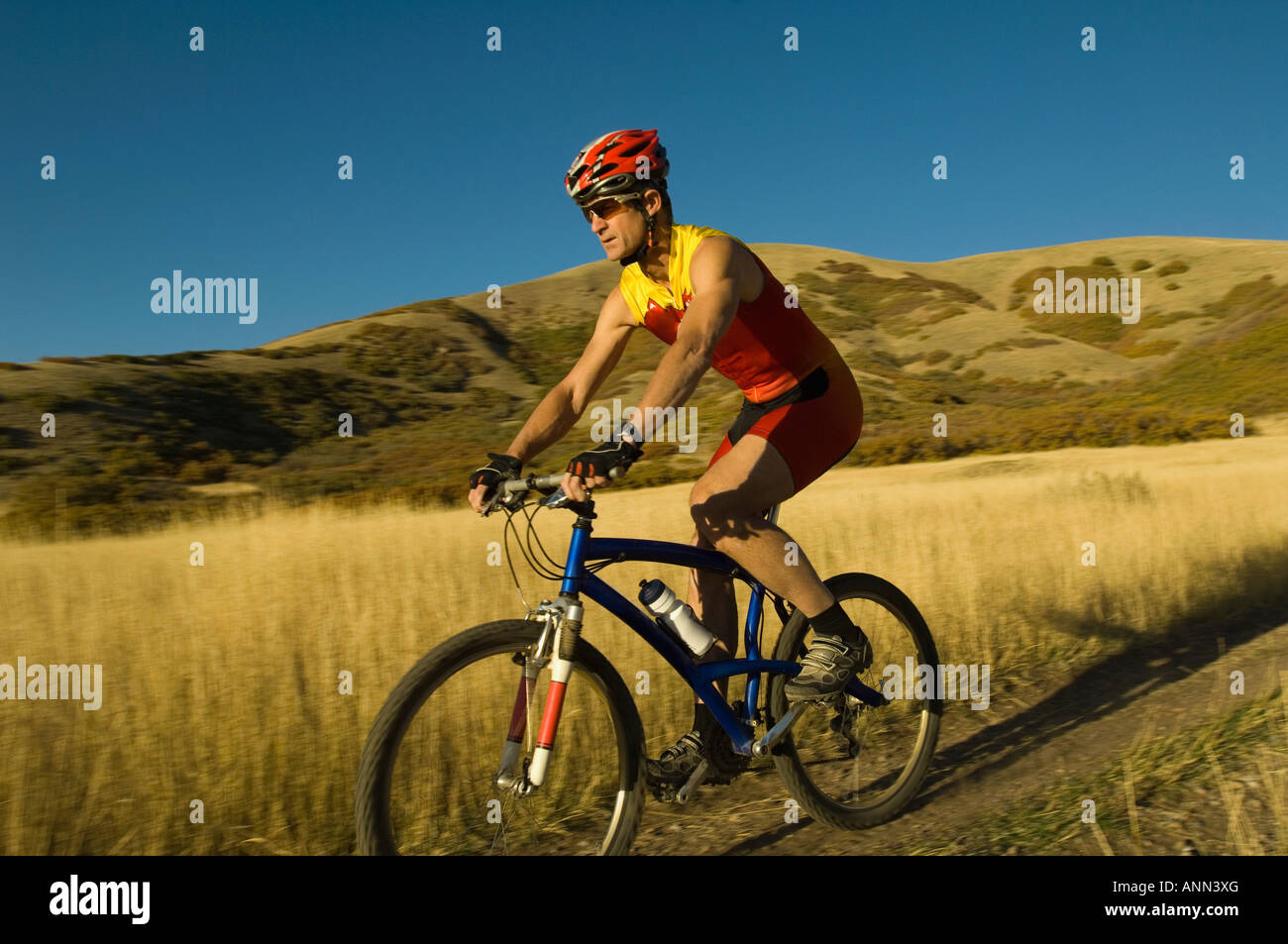 Man riding mountain bike, Salt Flats, Utah, United States Stock Photo