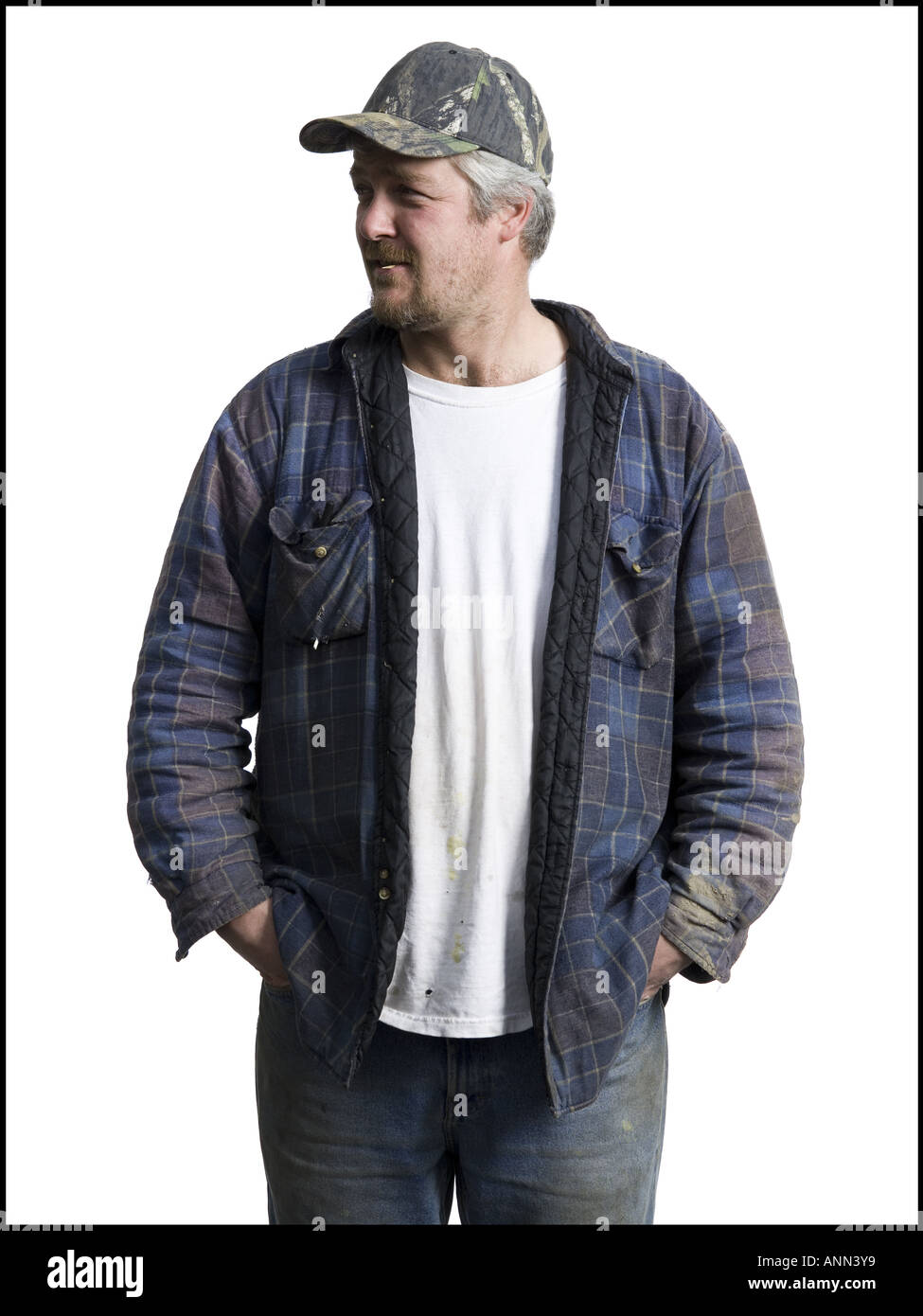 Close up of a man standing with his hands in his pockets Stock Photo