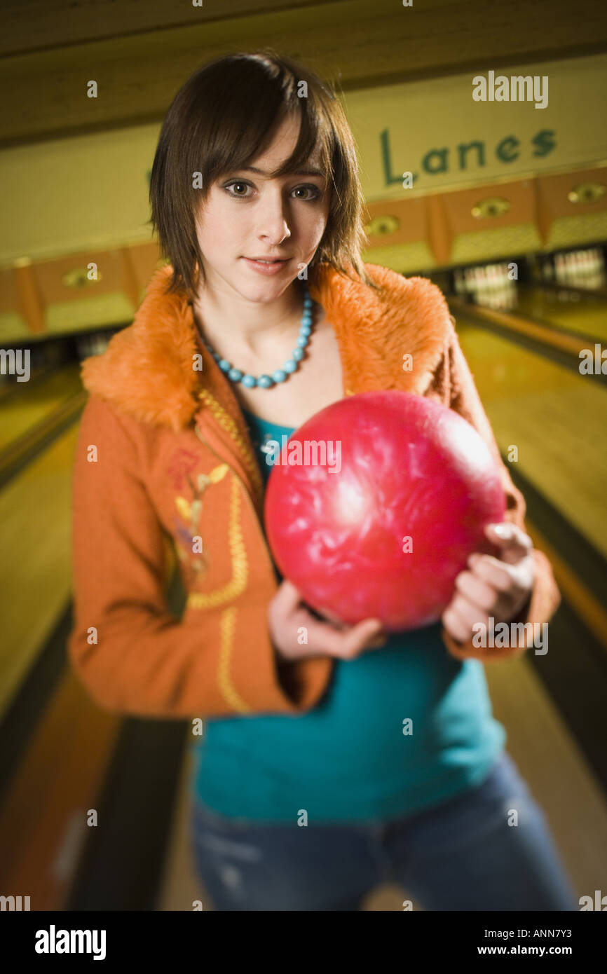Portrait of a teenage girl holding a bowling ball Stock Photo Alamy