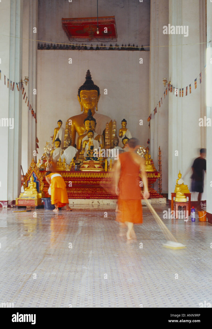 monks cleaning temple, That Luang temple Stock Photo