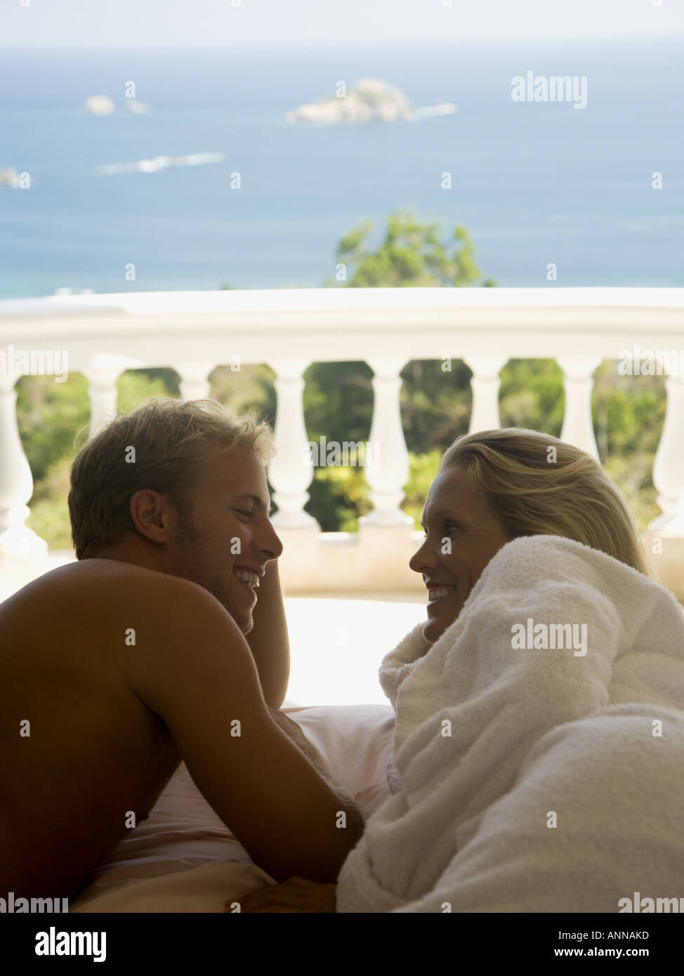 Close up of a man and woman lying in bed Stock Photo - Alamy