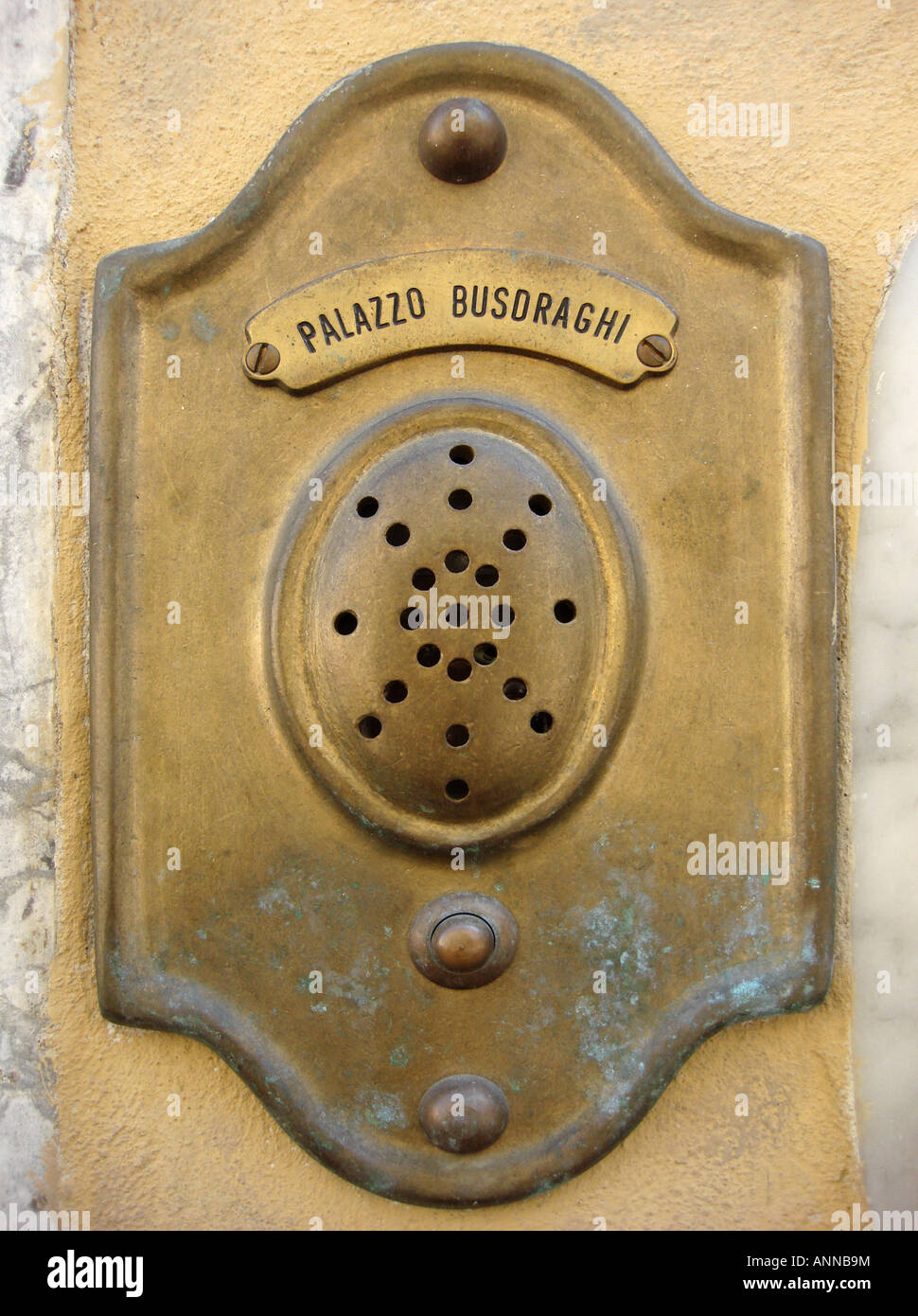 Old brass door buzzer of the Palazzo Busoraghi in Lucca Stock Photo