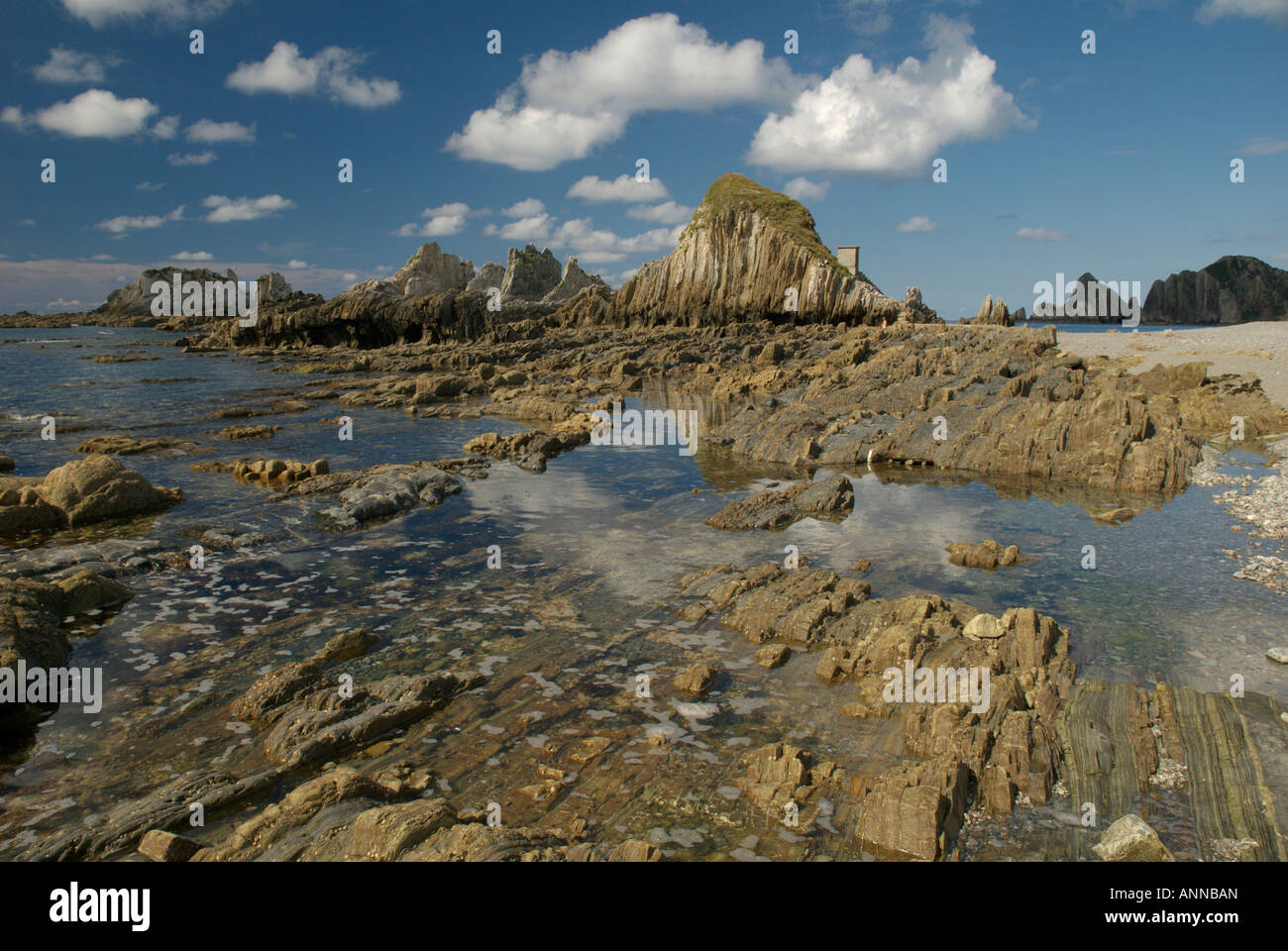 The rocky Atlantic coastline at Playa de Gairua, Santa Marina Stock Photo