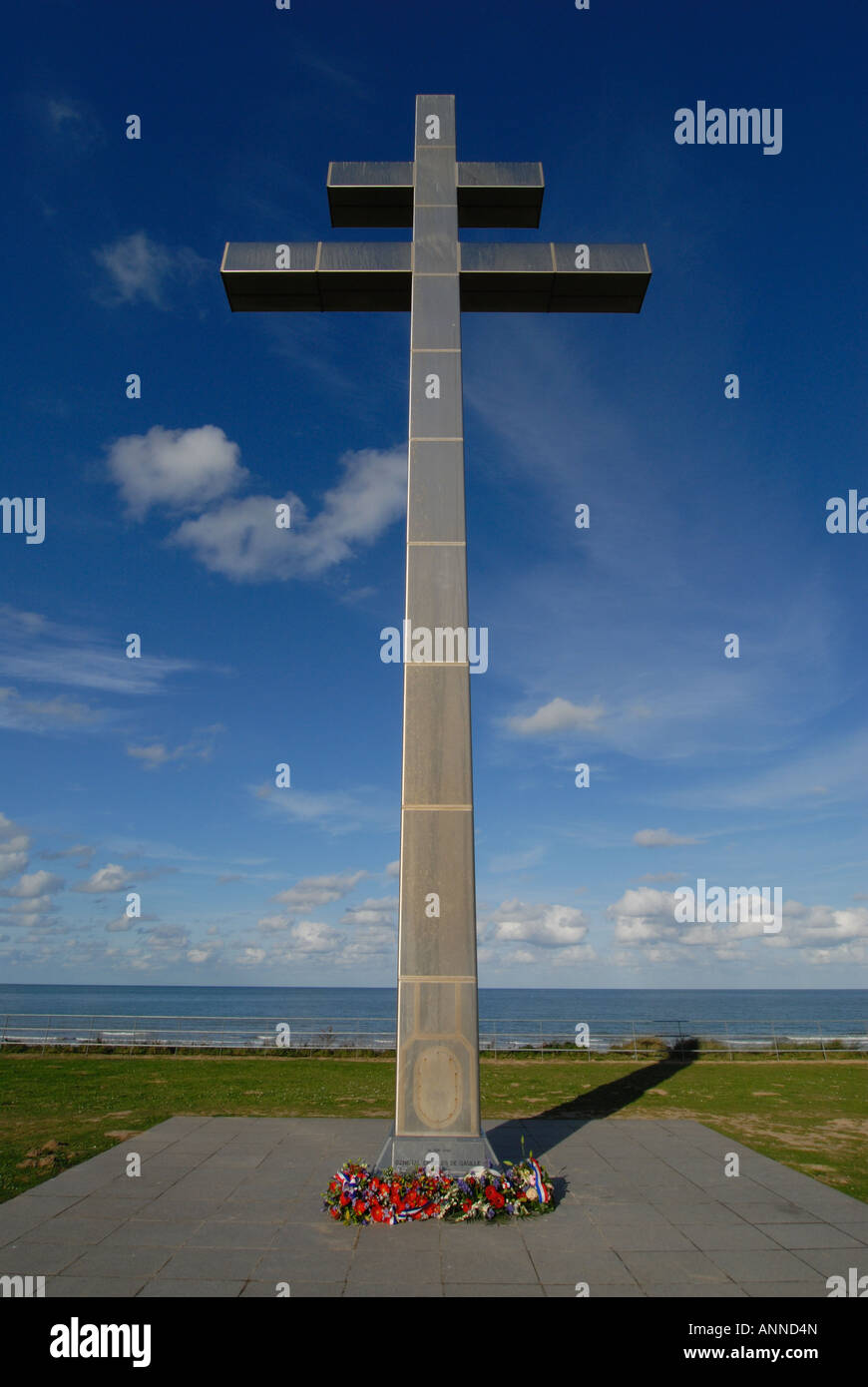 Cross of Lorraine Memorial commemorating return of General de Gaulle, D-Day landing beach, Normandy, France Stock Photo