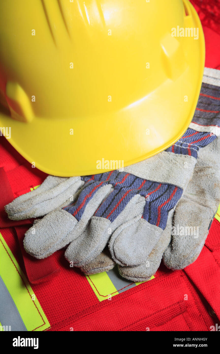 Work concept with hard hat gloves on safety vest Stock Photo Alamy