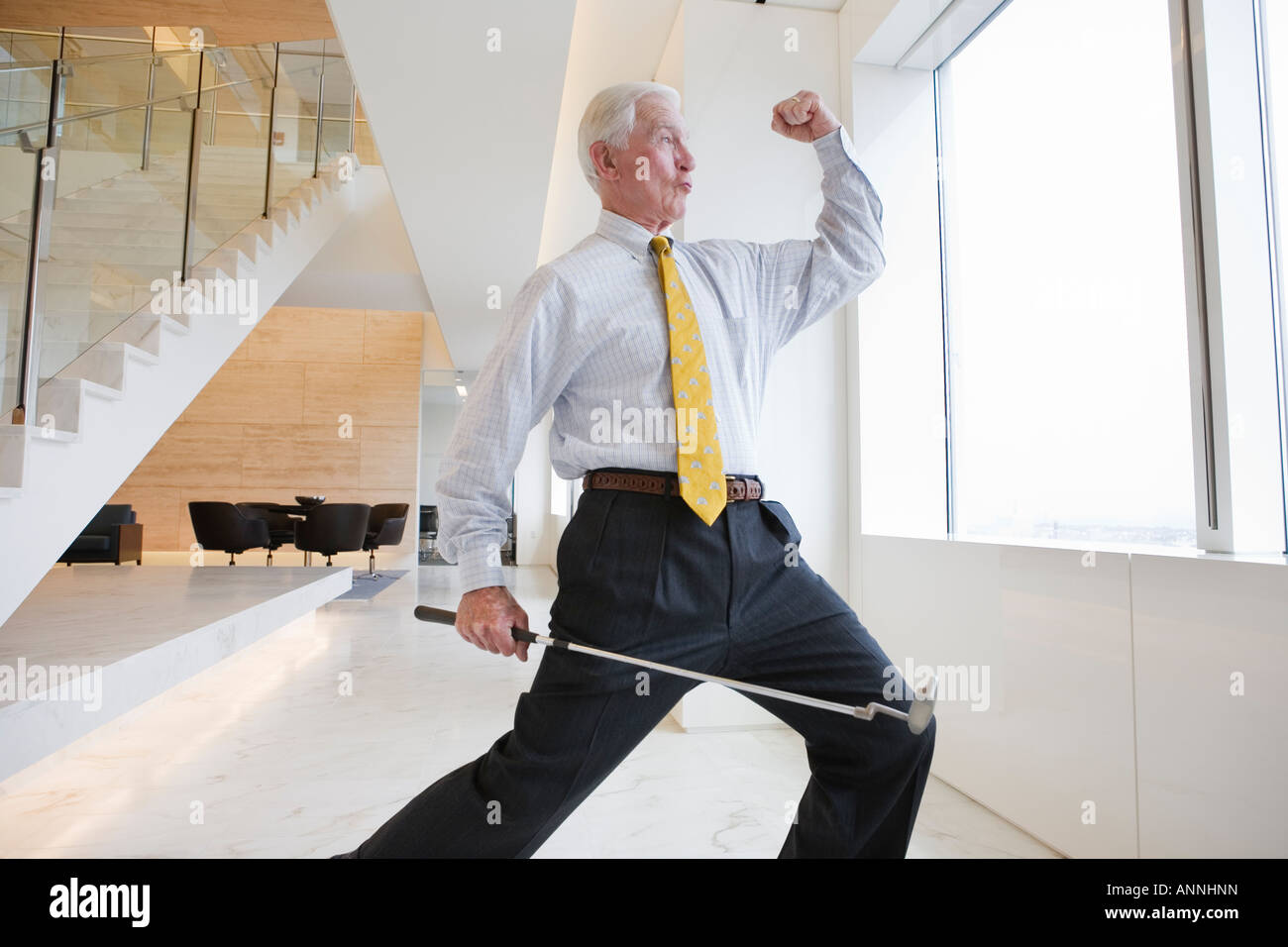 View of a excited businessman standing in an office. Stock Photo