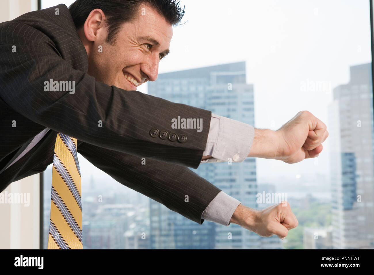 Businessman smiling in an office Stock Photo - Alamy