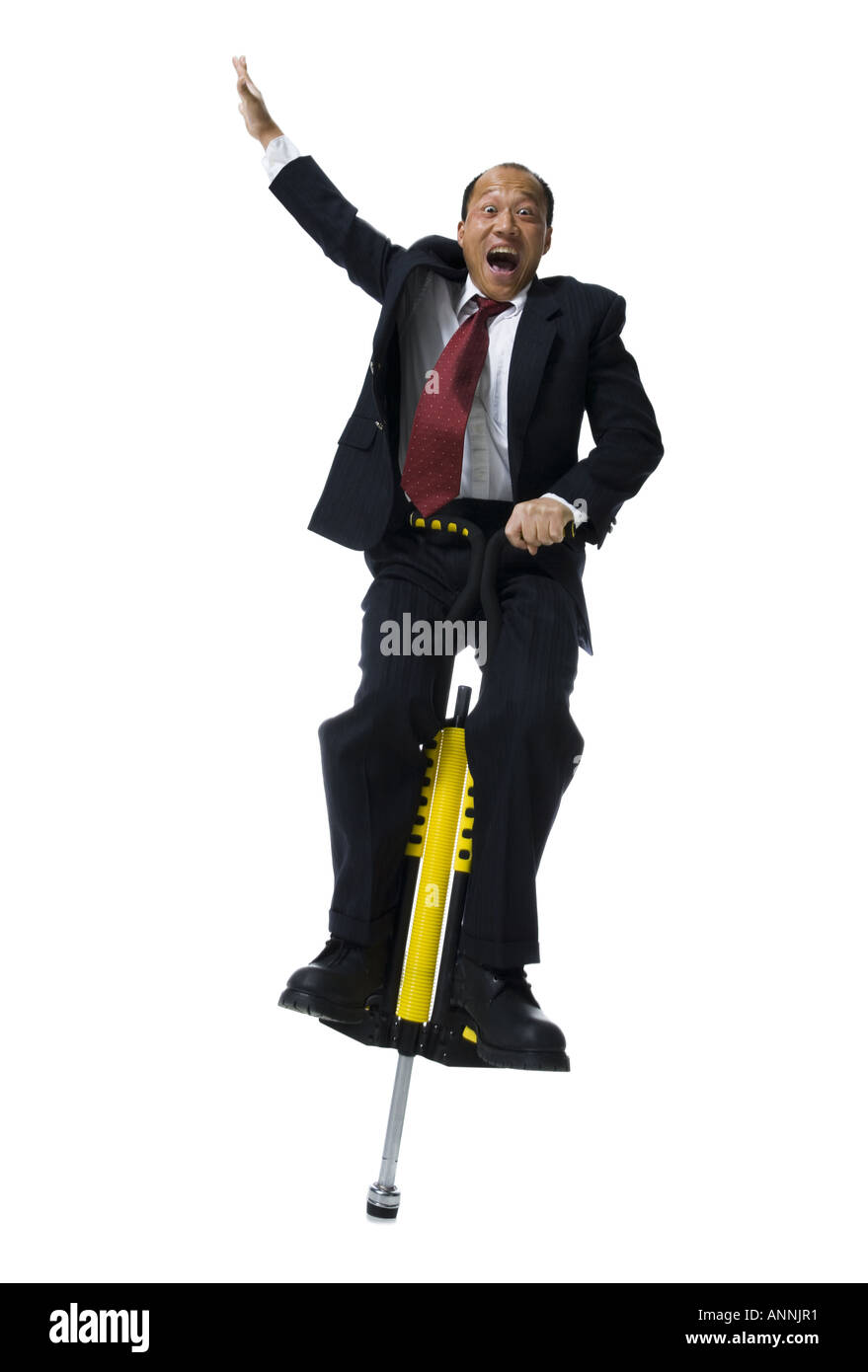Man jumping on pogo stick Cut Out Stock Images & Pictures Alamy