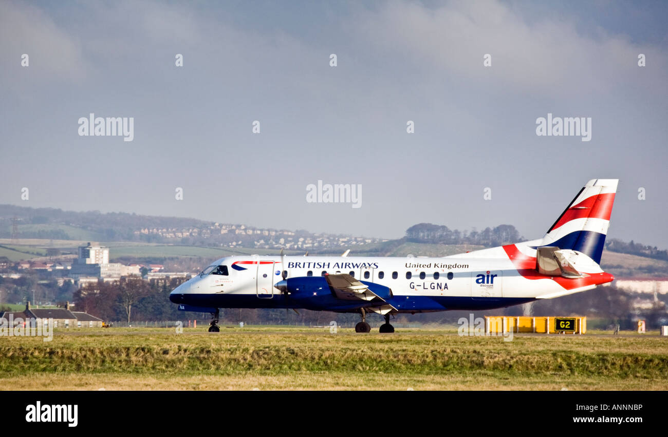 British Airways Saab 340B twin turboprop on the runway. Stock Photo