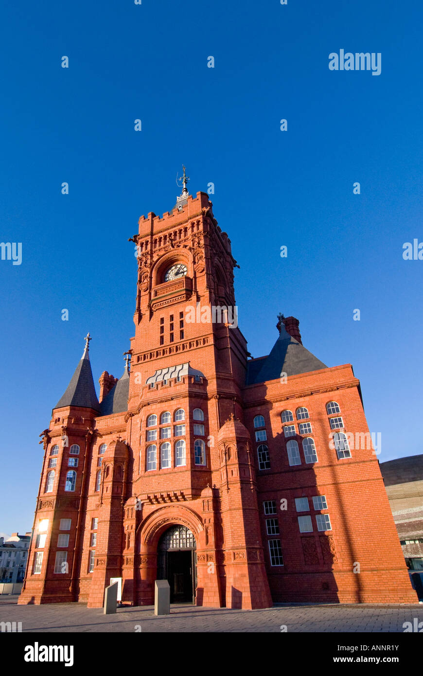 Vertical wide angle of the distinctive redbrick Pierhead Building, formerly the Bute Dock Company headquarters, in Cardiff Bay. Stock Photo