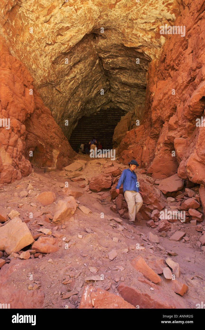 Hikers look at the steel bat gate at Stanton's Cave in Grand Canyon National Park, Arizona, United States. Stock Photo