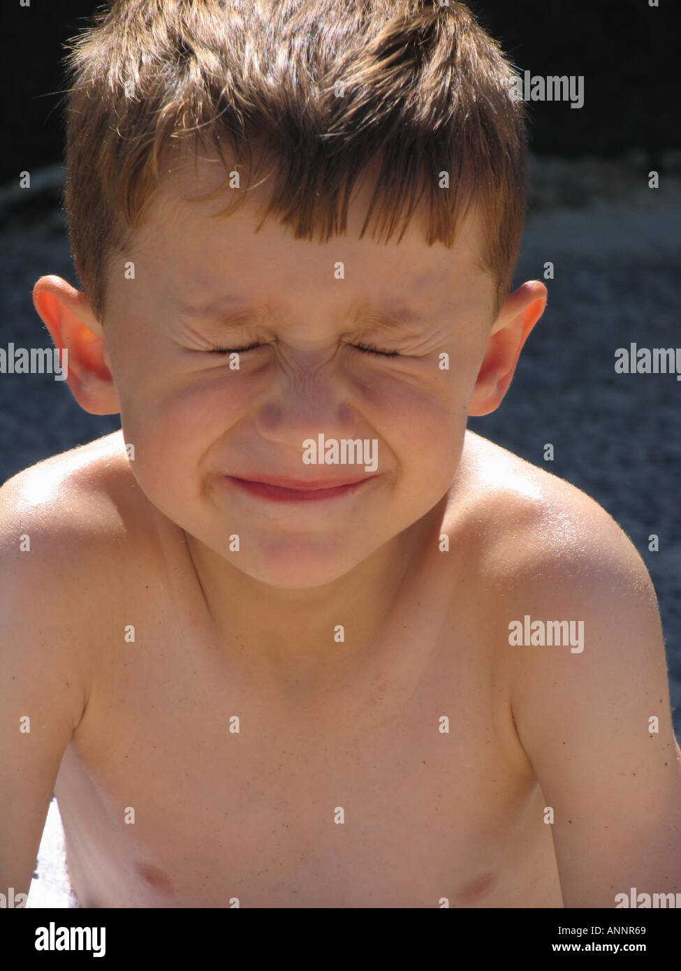 Yound boy with eyes closed Stock Photo