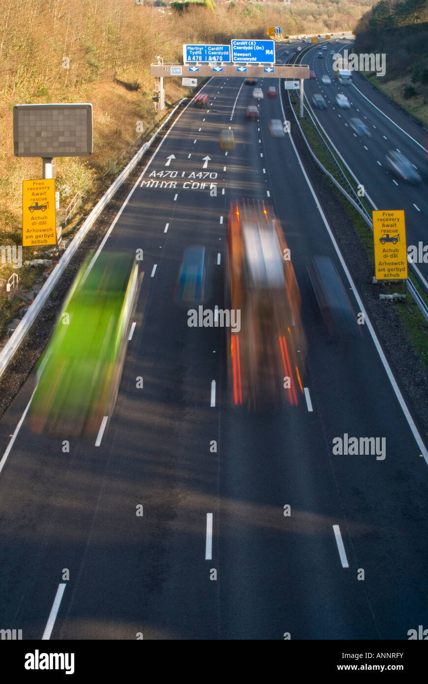 Vertical aerial view of lots of traffic speeding along the M4 motorway ...