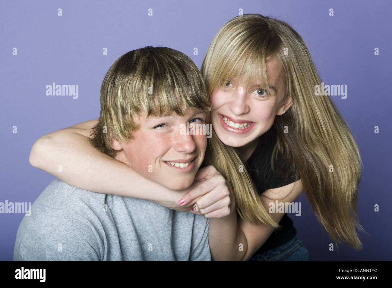 Portrait of a teenage boy and a teenage girl smiling Stock Photo - Alamy