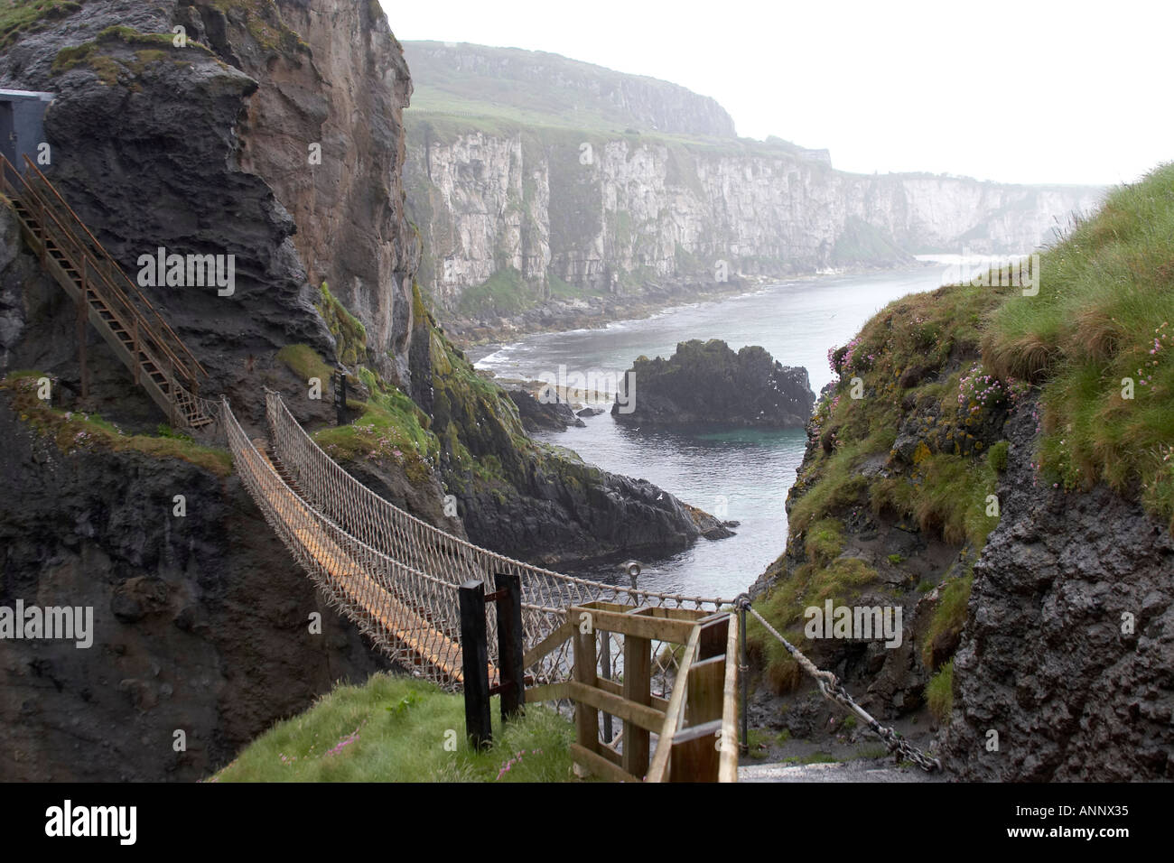 Carrick a rede Rope Bridge National Trust with Larrybane Bay in the