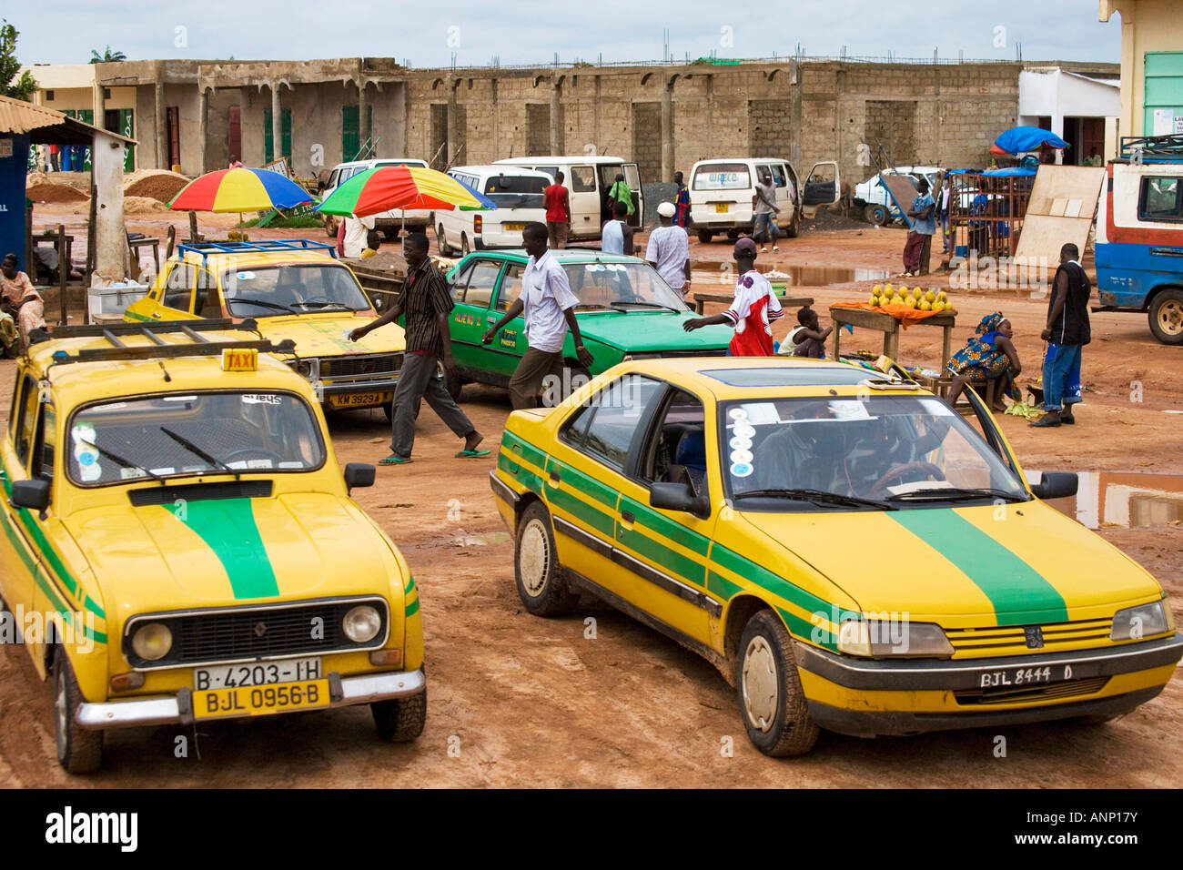 A typical street scene in the Gambia, west Africa with taxi cabs in the
