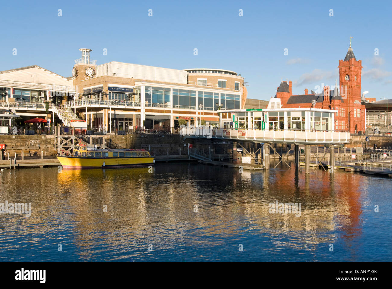 Horizontal wide angle of the regenerated Cardiff Bay (Bae Caerdydd) area Mermaid Quay and the Pierhead building on a sunny day Stock Photo