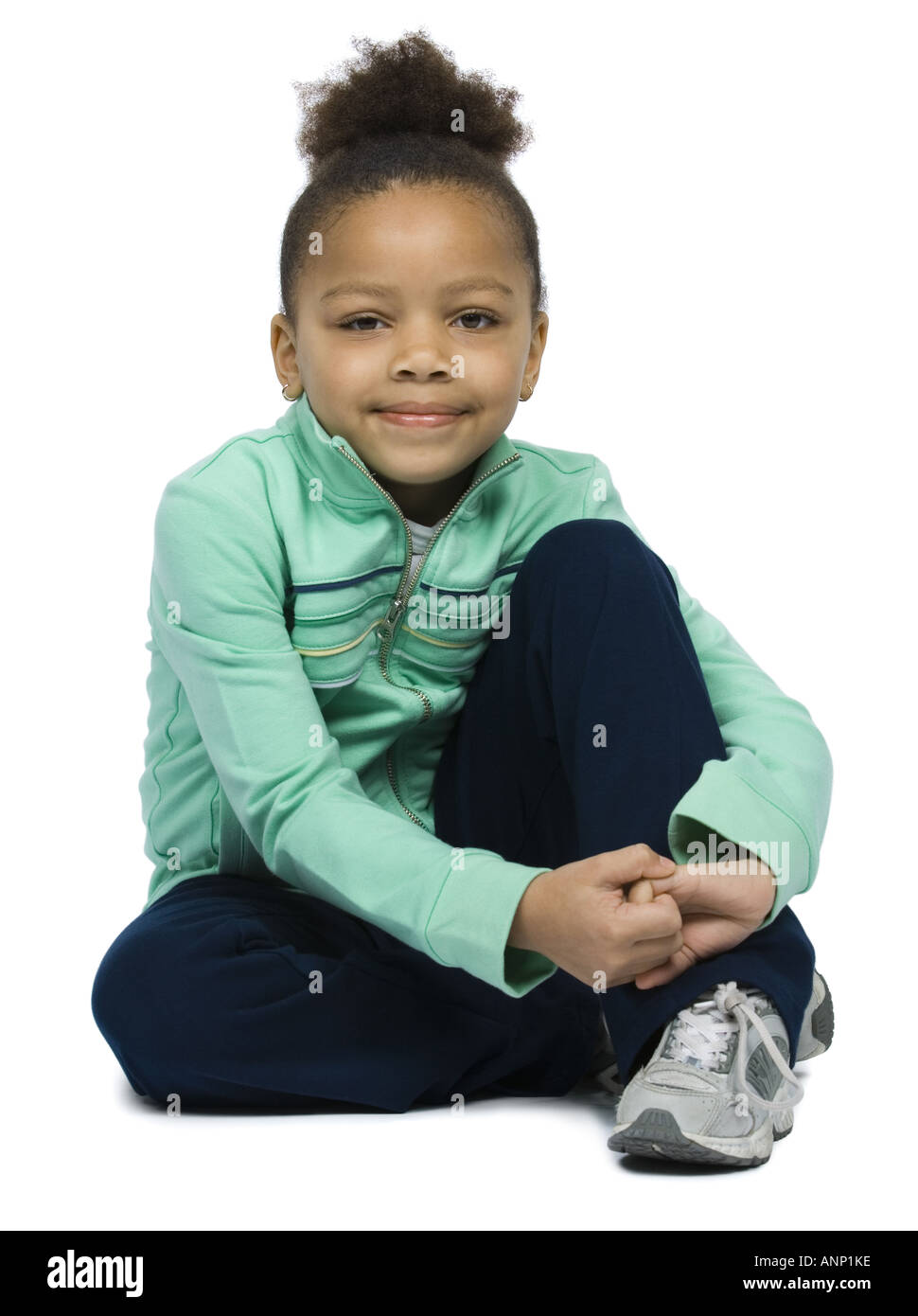 Portrait of a girl hugging her knees Stock Photo - Alamy