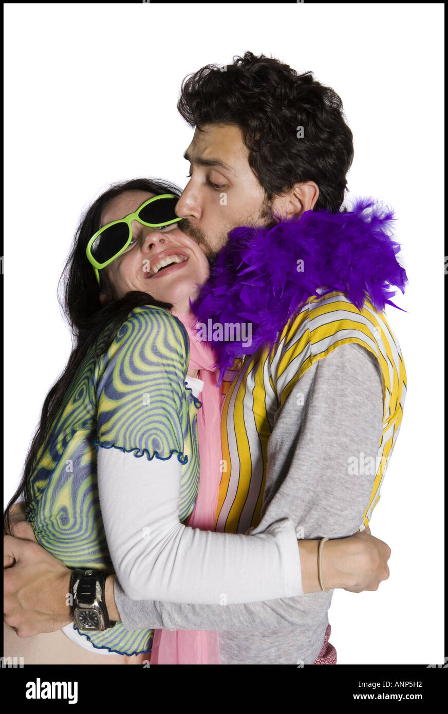 Profile of a young man kissing a young woman Stock Photo - Alamy