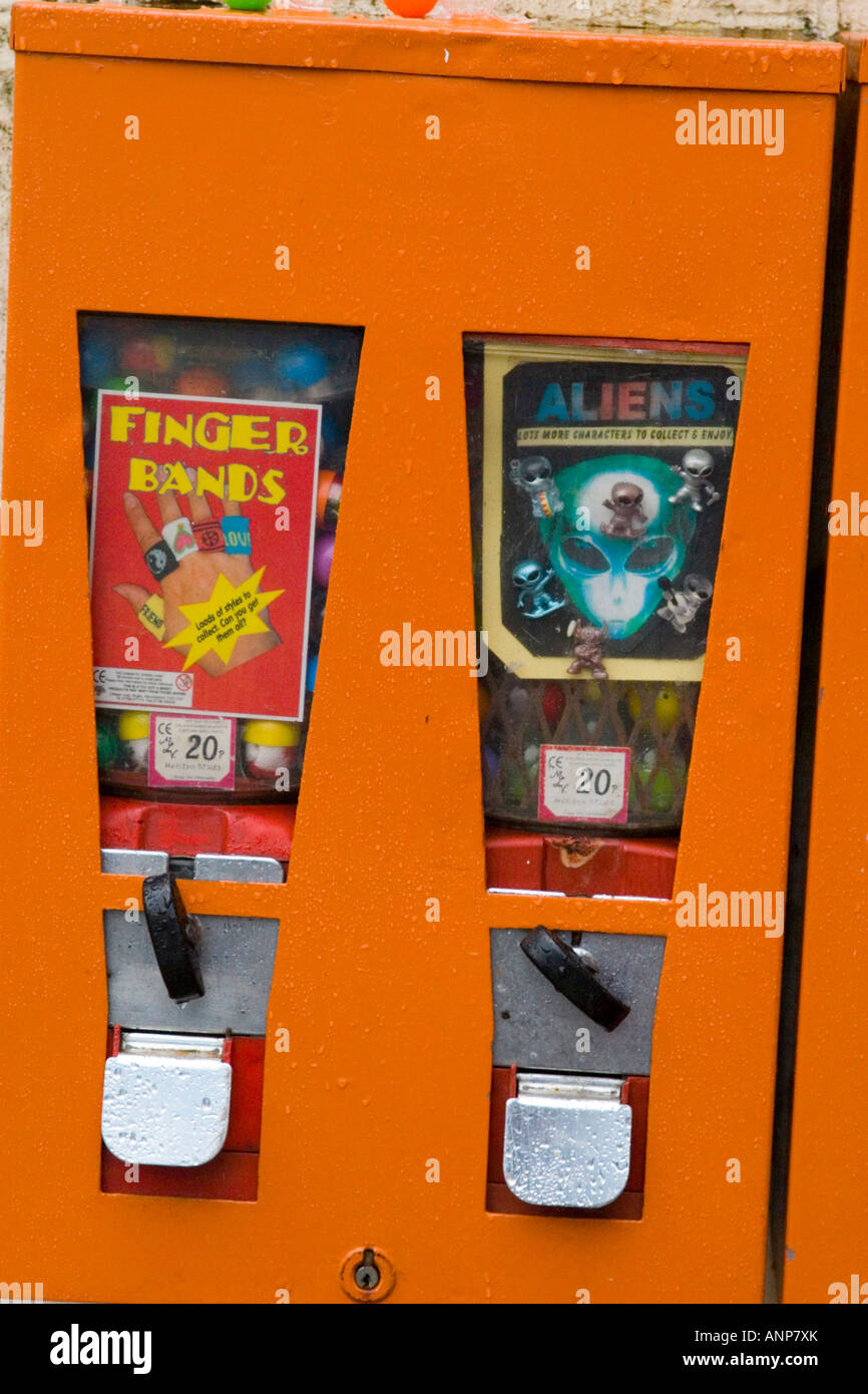 Toy and sweet vending machines with coin operated slots Stock Photo