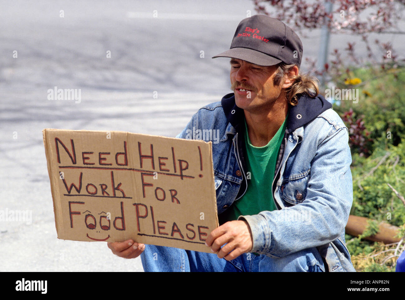 Homeless Man Holding A Sign Stock Photo Alamy