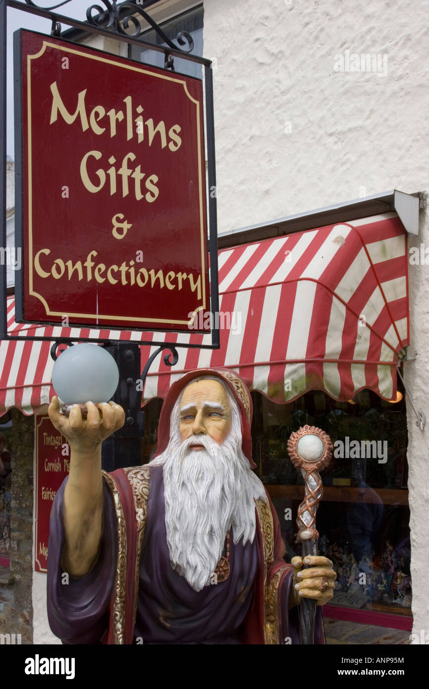 A plastic figure of the famous wizard Merlin holding an orb outside a