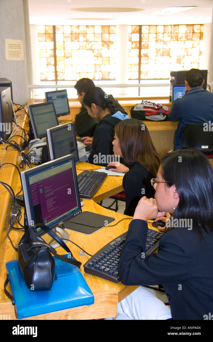 Students do research on computers in the Central Library at the National Autonomous University of Mexico in Mexico City Mexico Stock Photo