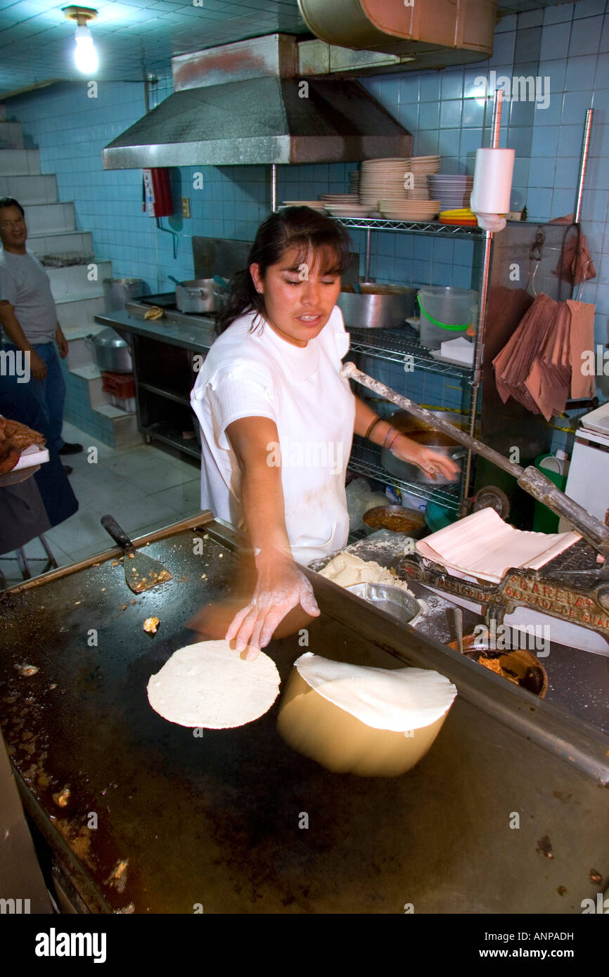 Mexican woman making corn tortillas at the Merced Market in Mexico City Mexico Stock Photo