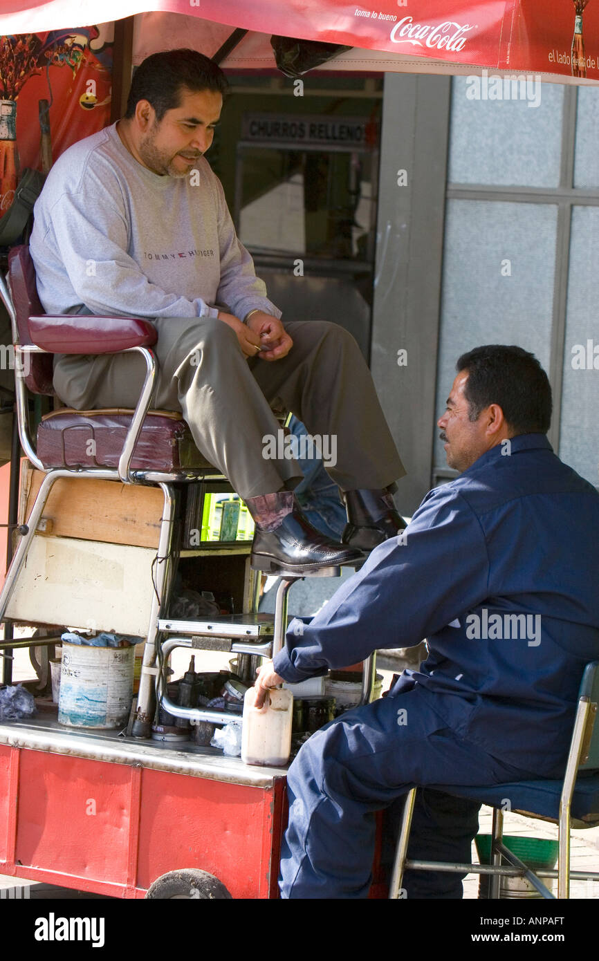 A shoeshiner at Insurgentes Plaza in Mexico City Mexico Stock Photo