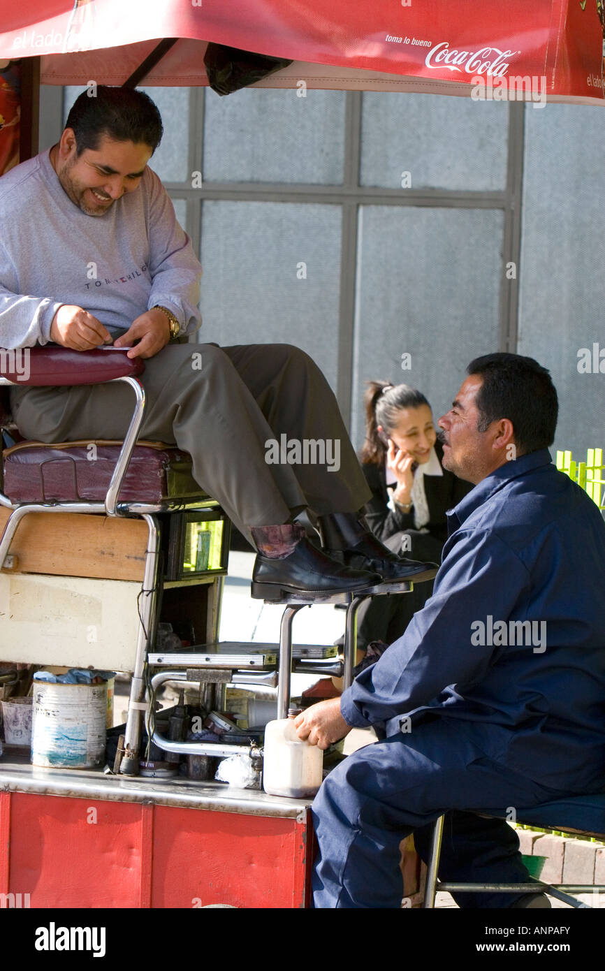 A shoeshiner at Insurgentes Plaza in Mexico City Mexico Stock Photo
