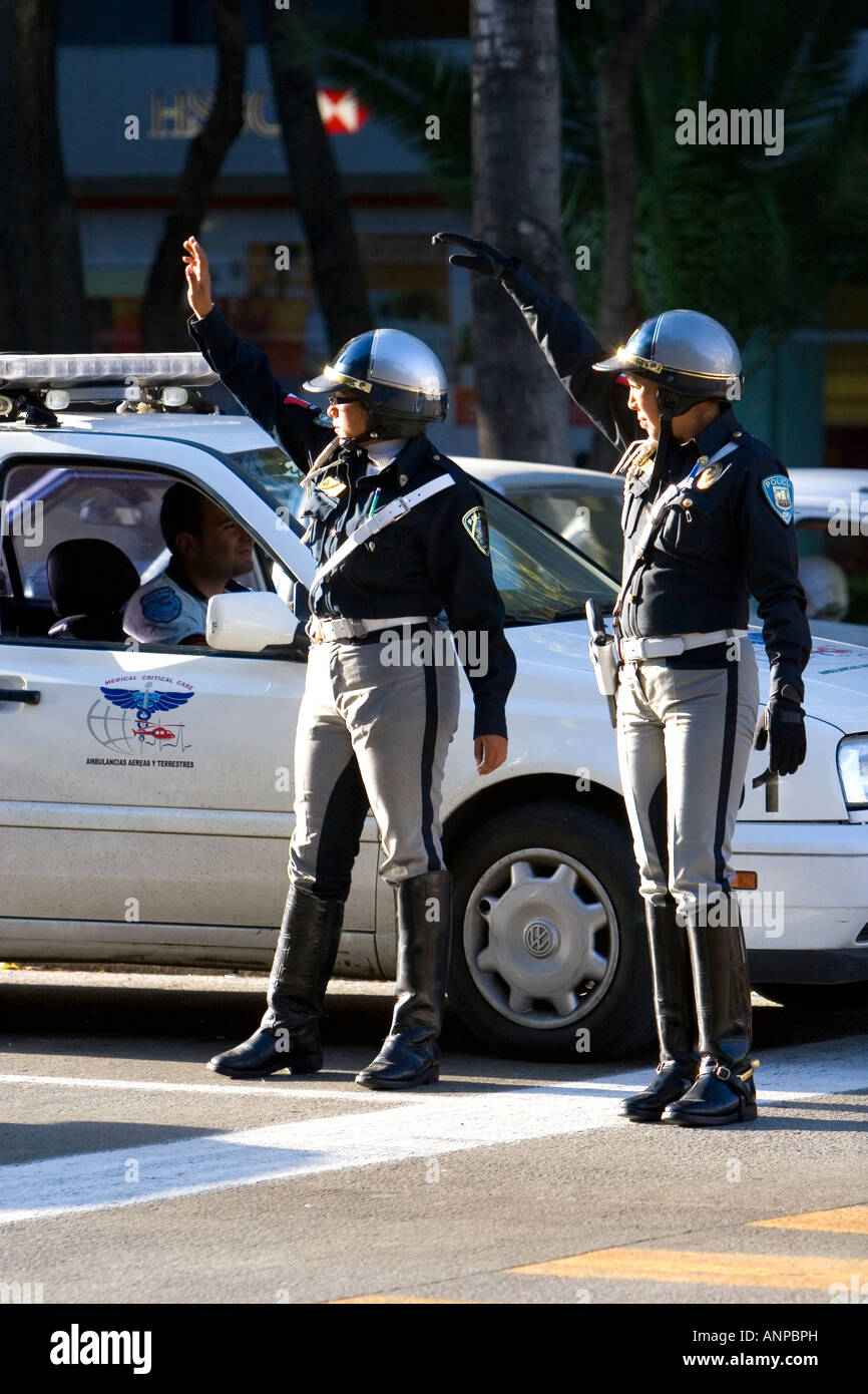 Female police officers directing traffic in Mexico City Mexico Stock Photo