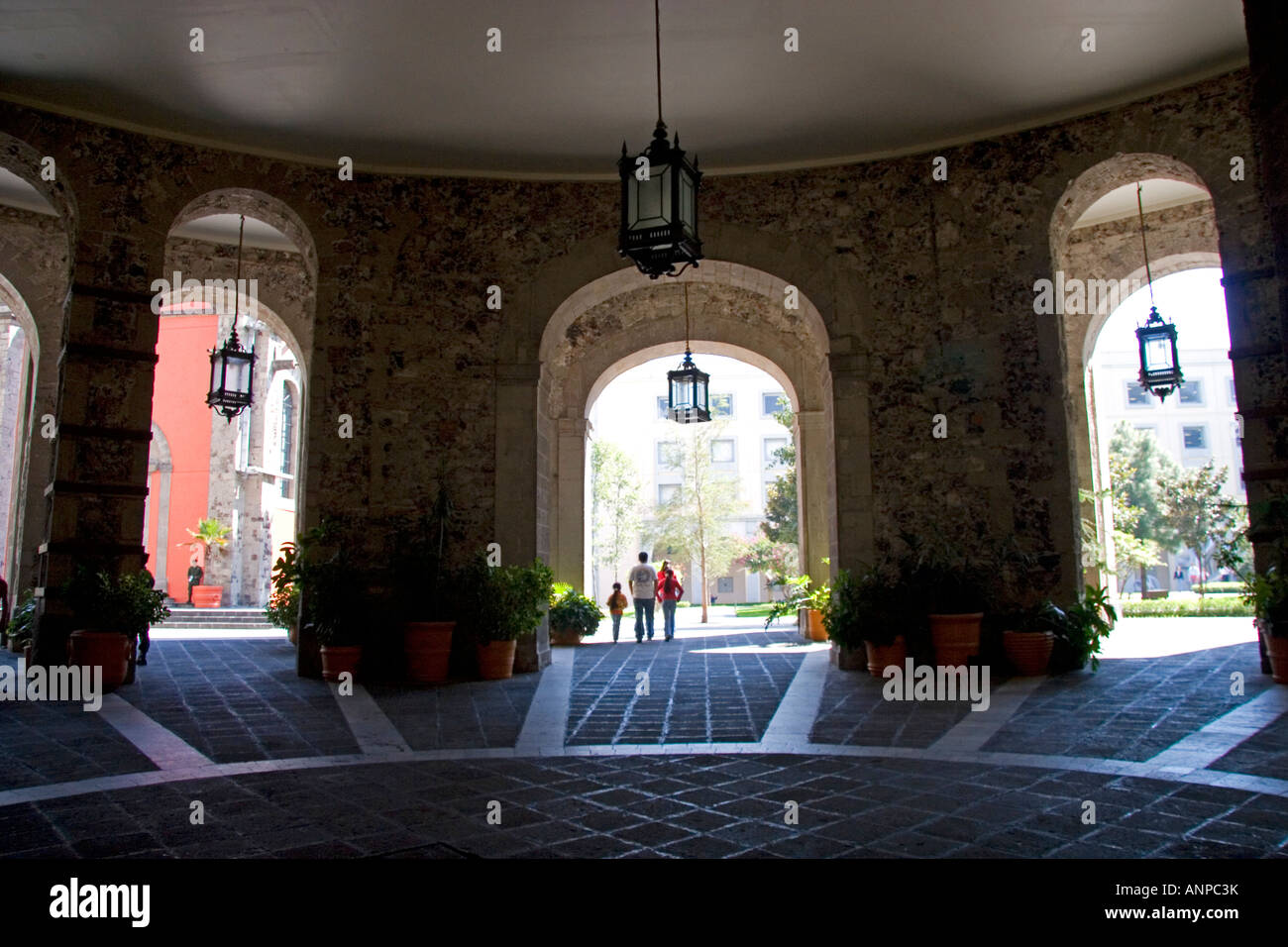 Archways frame the inner court yard at the National Palace in Mexico City Mexico Stock Photo