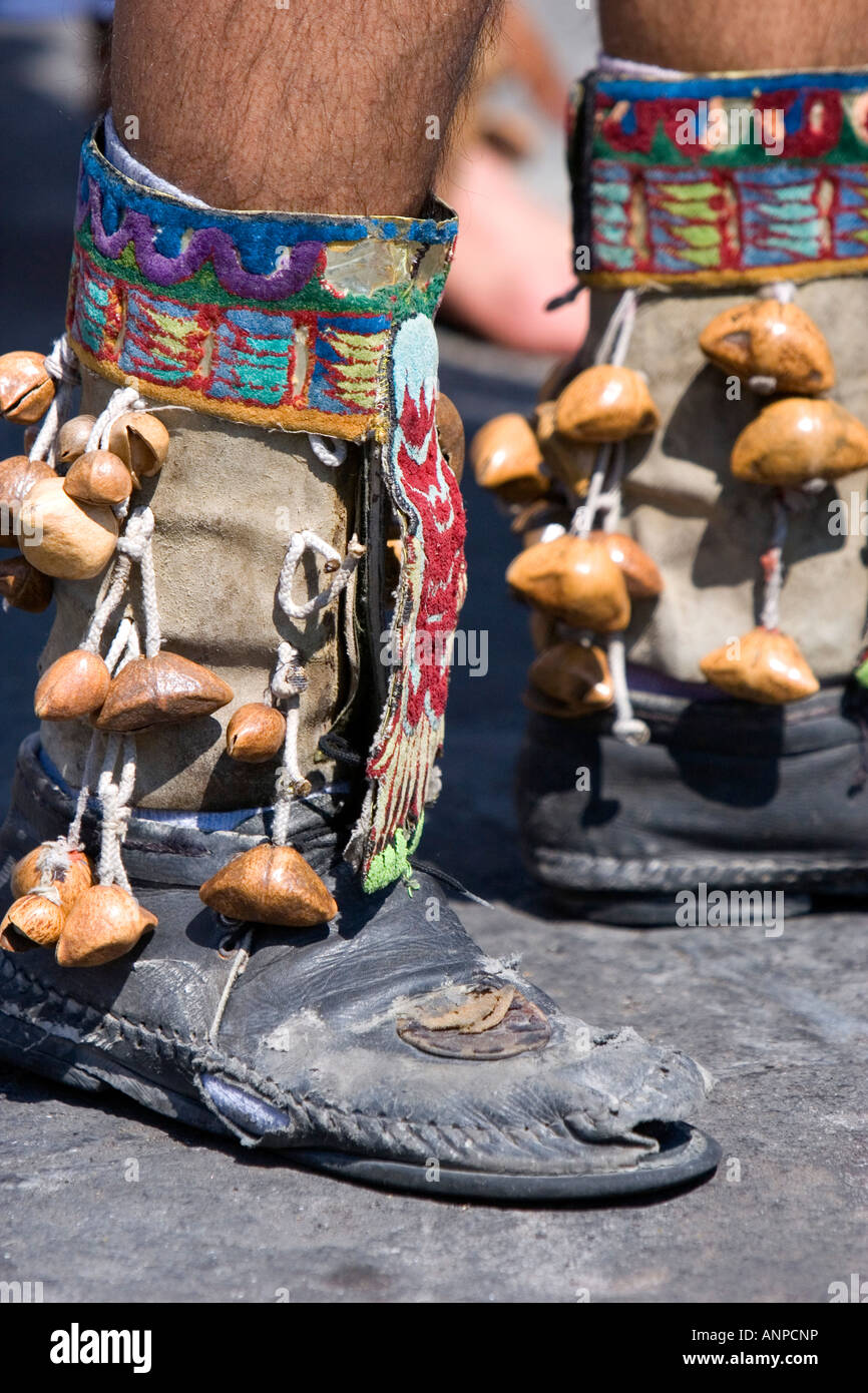 Aztec indian wearing boots with nutshells during a celebration for the Day of the Dead in Mexico City Mexico Stock Photo