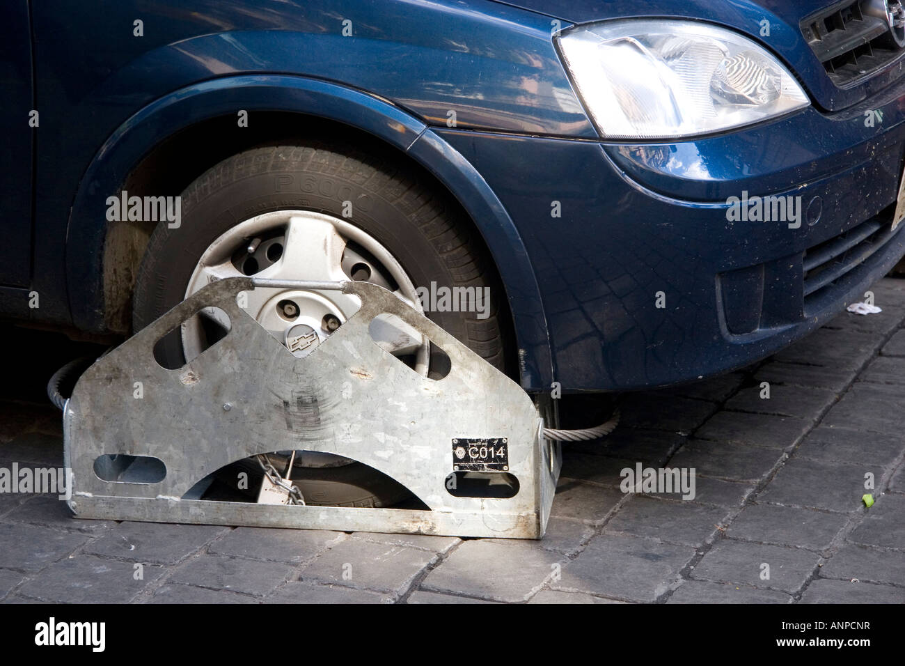 Wheel clamp used instead of towing an illegally parked car in Mexico City Mexico Stock Photo Alamy