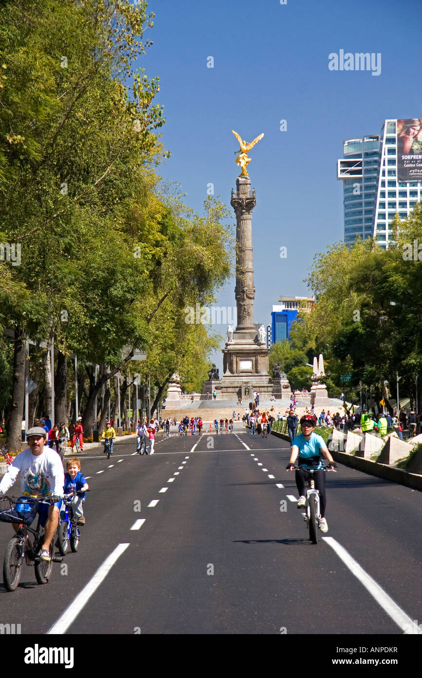 Bicyclists ride on the Paseo de la Reforma with no traffic on a Sunday ...