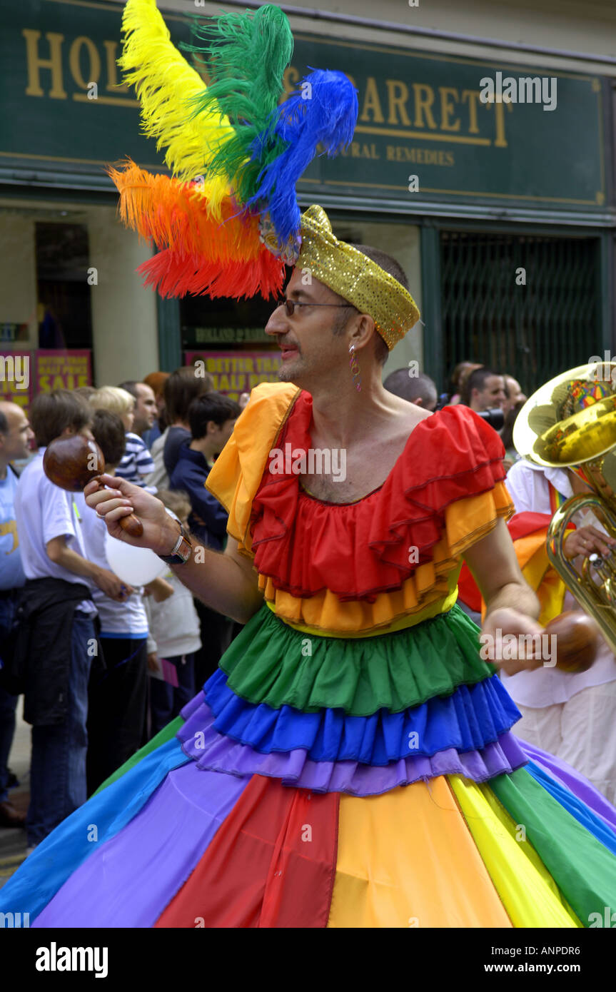 transvestite tv tranny male dress flamboyant extravagant colourful  rainbow flag manchester man dress fancy dress costume gay p Stock Photo