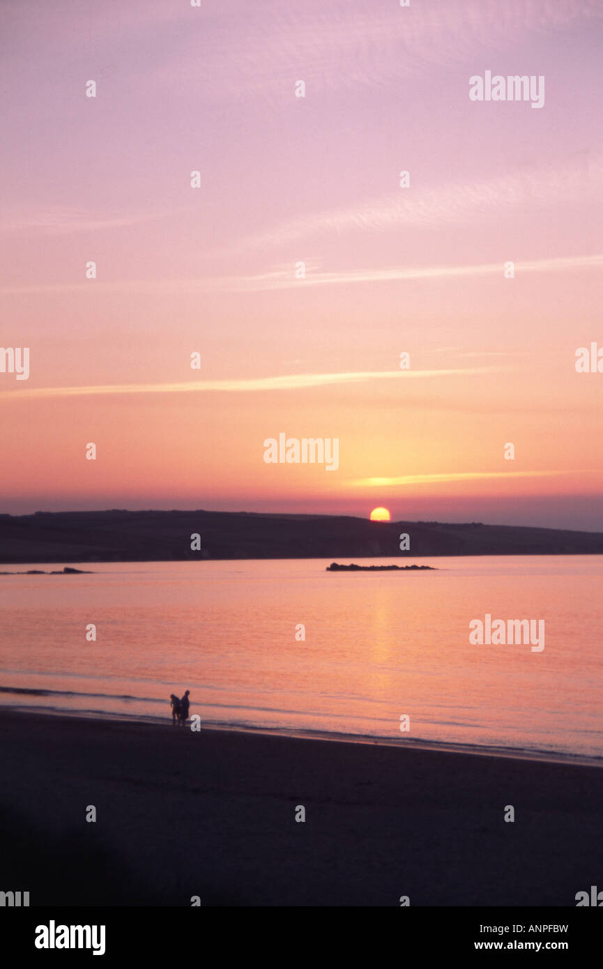 Man woman watching sunset over hi-res stock photography and images - Alamy