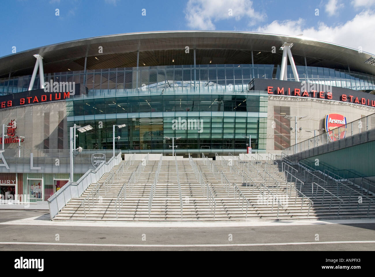 Wide stairway of steps & crowd control barriers at Arsenal FC modern design of Emirates Premier League football stadium building Holloway London UK Stock Photo