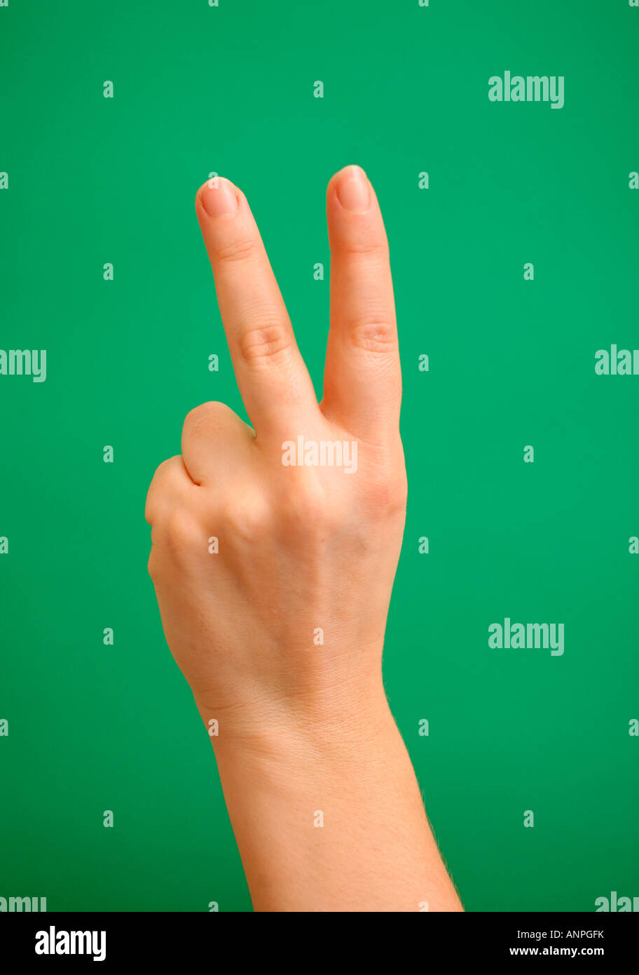 A woman giving two fingers Stock Photo