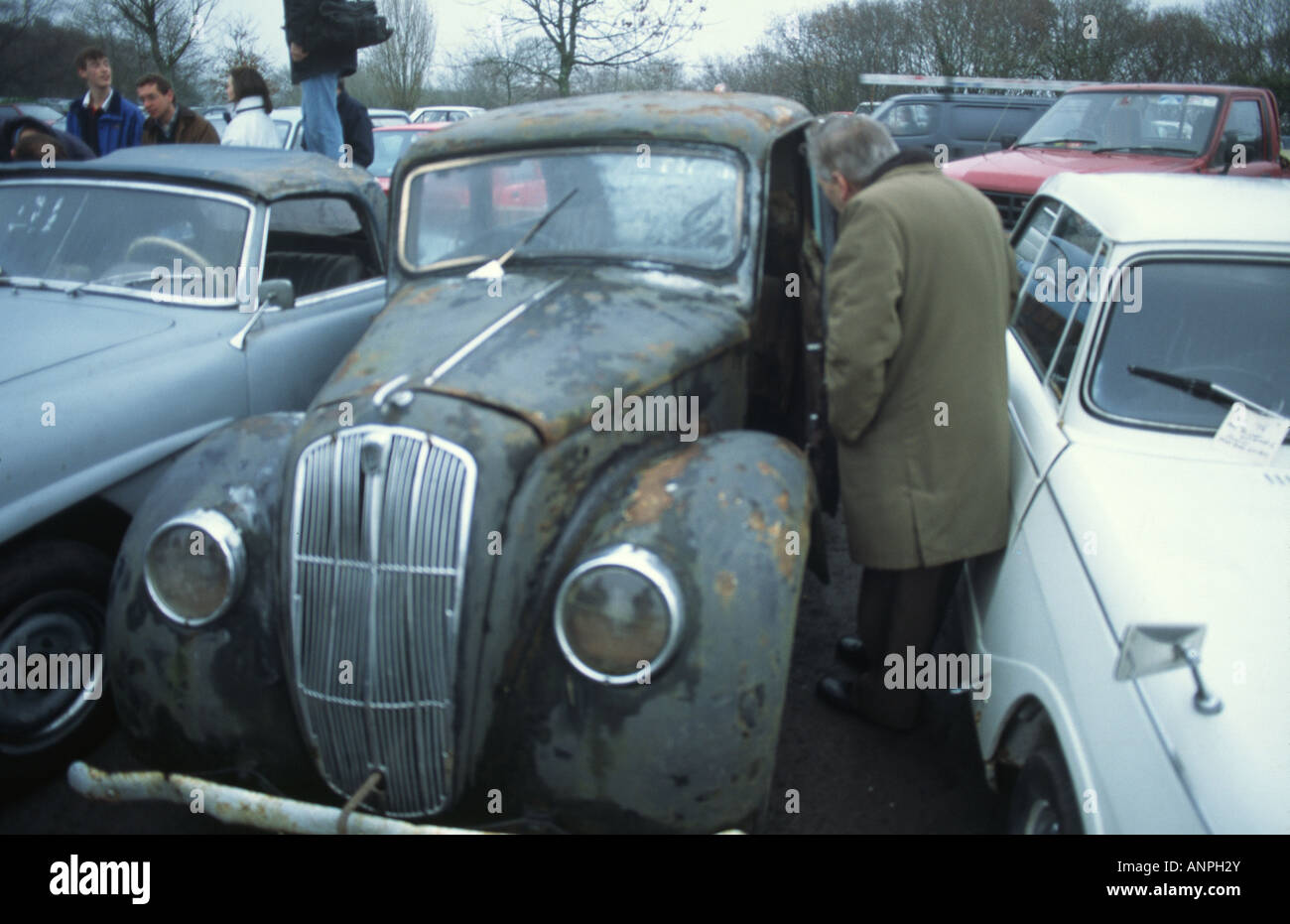 man inspecting an old car Stock Photo - Alamy