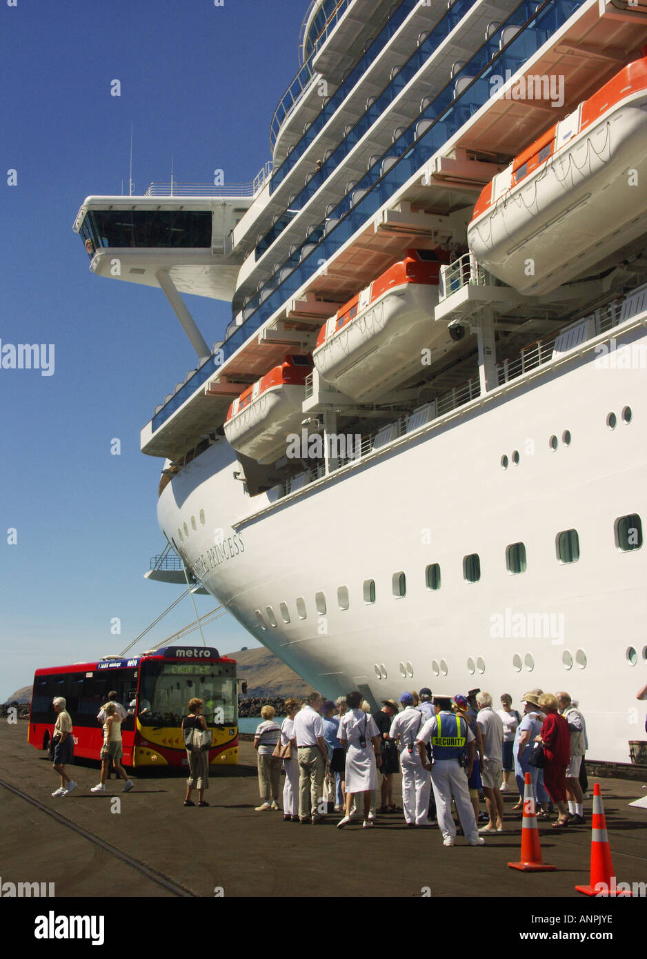 Cruise passengers waiting to board a tour bus at Lyttelton, New Zealand Stock Photo