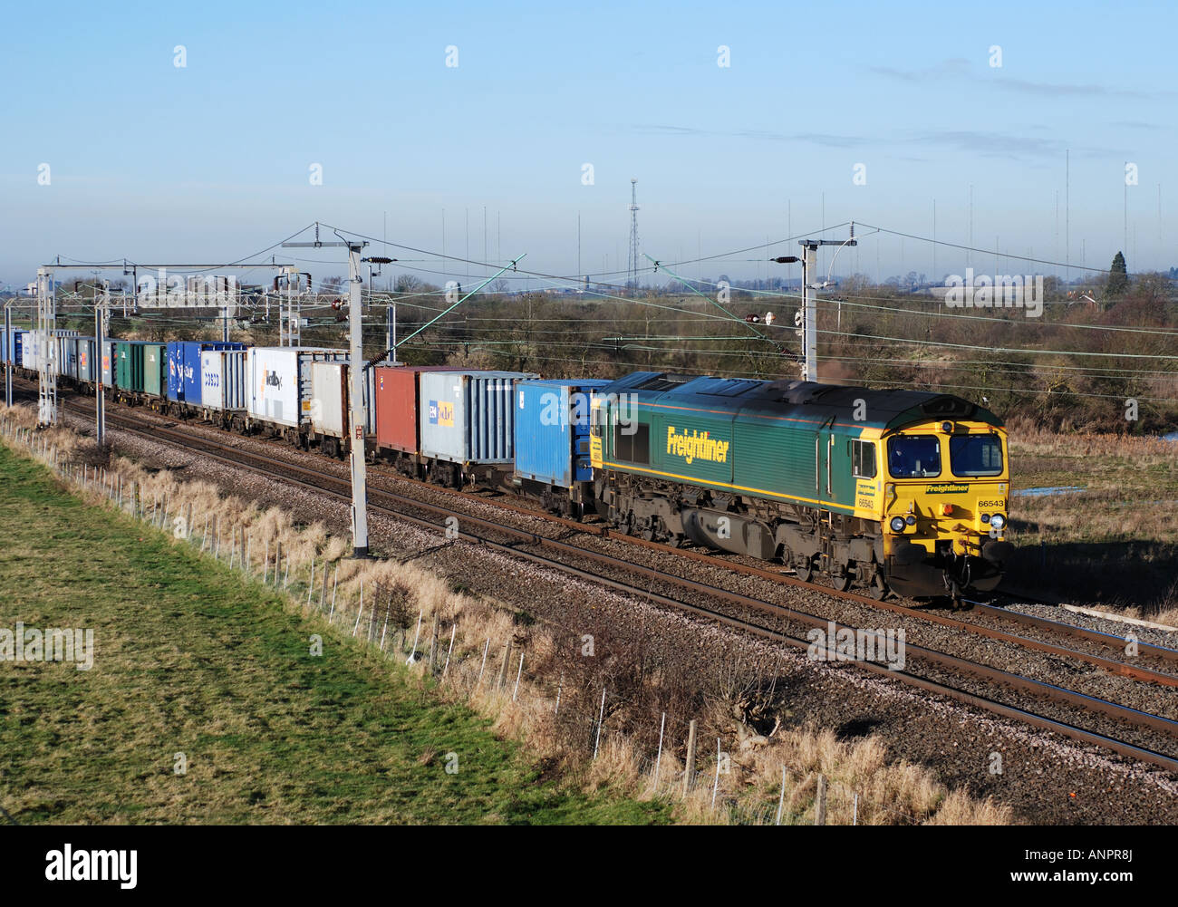 Class 66 diesel locomotive pulling freightliner train near Rugby ...
